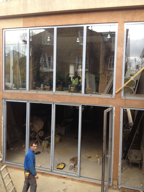 Aluminium bi-fold doors with two-storey glazing in Barnet
