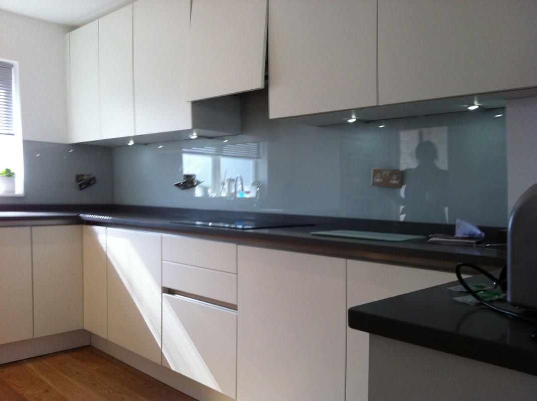 Grey glass kitchen splashback with LED lighting in Barnet
