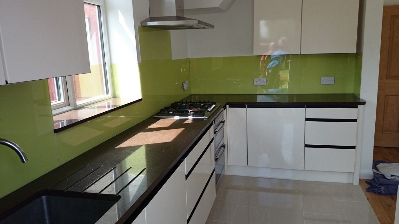 Lime green glass kitchen splashback installed by Barnet glaziers
