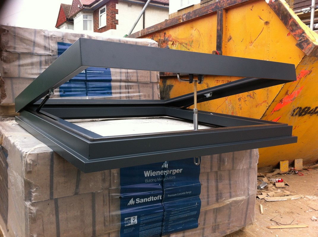 Opening flat roof skylight in anthracite grey installed in Barnet