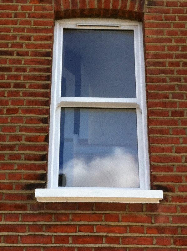 uPVC sash window on Victorian red brick house in Barnet